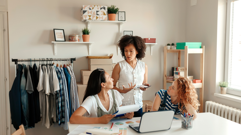 Let's celebrate woman with a look at three woman working in a clothing store