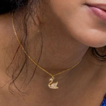 Swan necklace on a girl